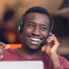 man with headset smiling