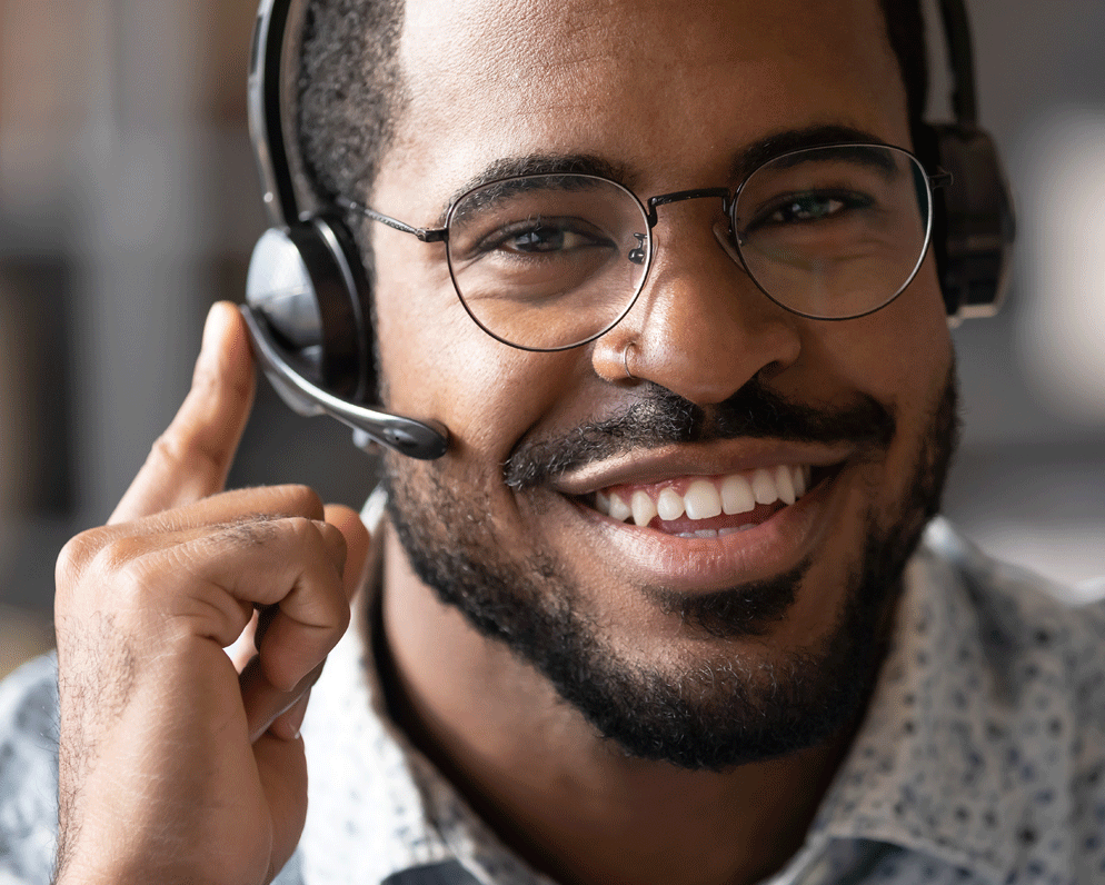 man with a phone headset smiling