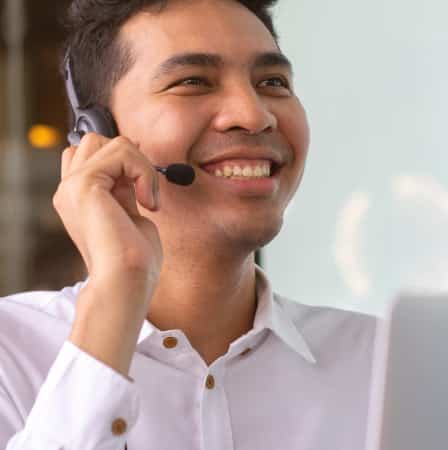 Man with phone headset smiling